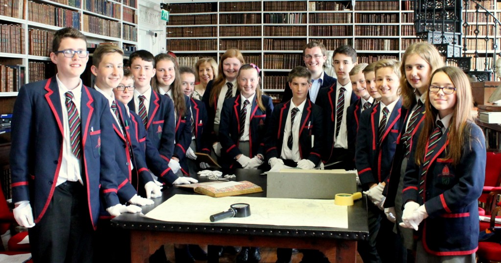 School visit to the Library: Royal School students during a hadnling session in the Long Room