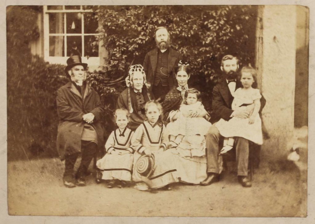 Family photograph of Gregg as a toddler with his parents, grandparents and siblings, ca 1874