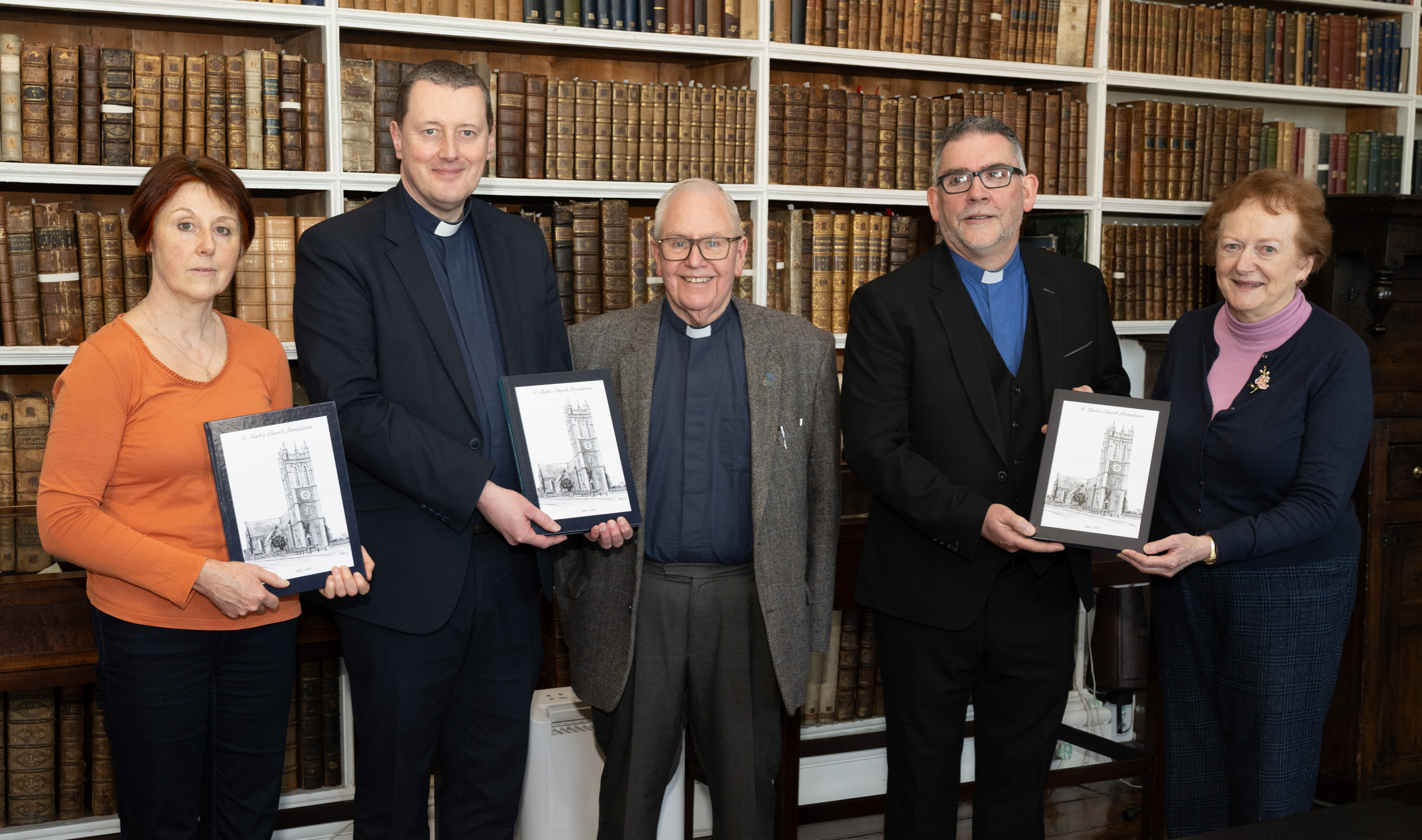 Library representatives were presented with copies at the book launch. From left: Catherine Gartland (Portadown Library and the Cultural Heritage Service Library), the Very Revd Shane Forster (Keeper of Armagh Robinson Library), the Revd Canon Bill Adair (Governor and Guardian of Armagh Robinson Library and Rector of St Columba’s Parish, Portadown), the Revd William Orr (Rector of St Mark’s Parish, Portadown) and Carol Conlin (Assistant Keeper of Armagh Robinson Library).